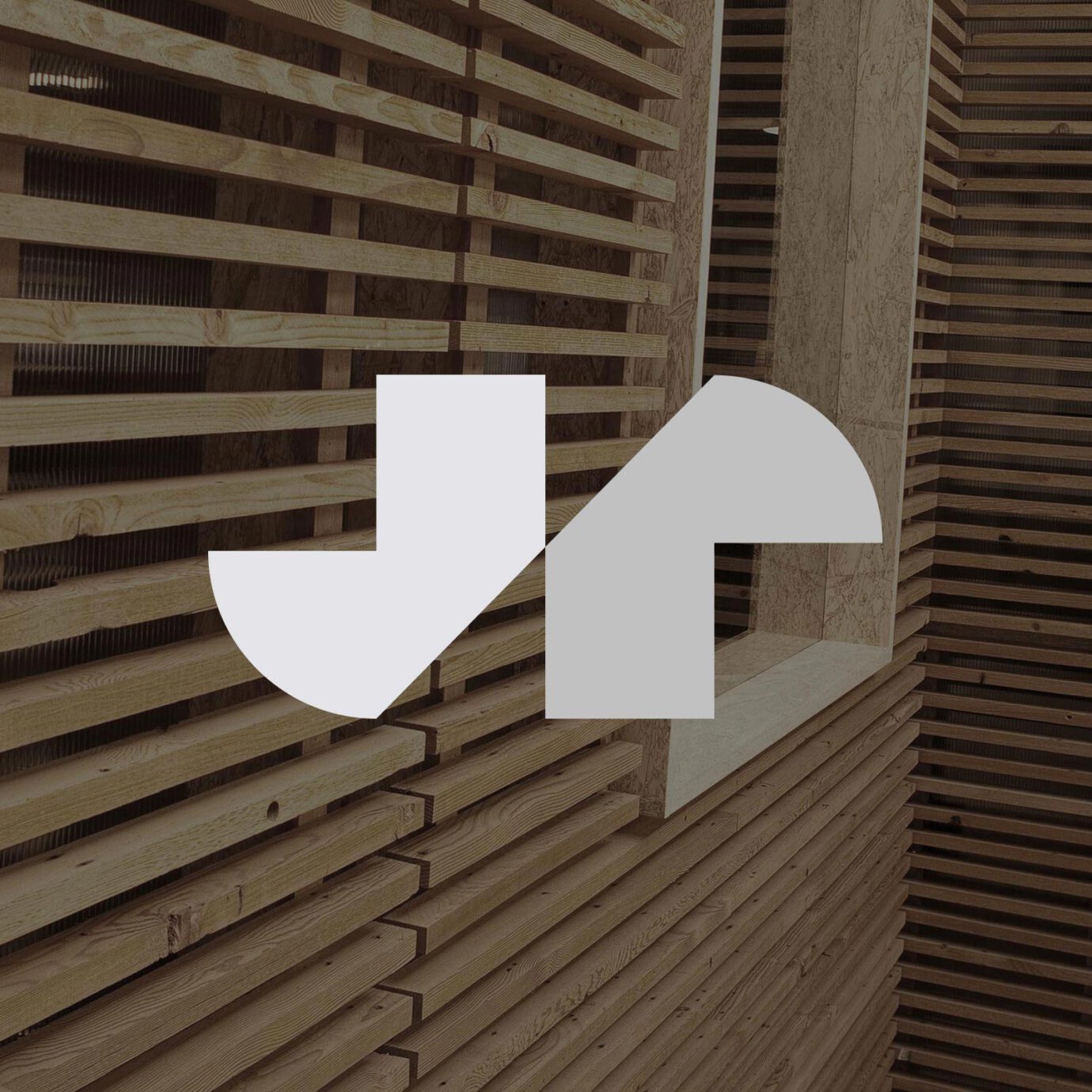 JR monogram logo superimposed over wood architectural background