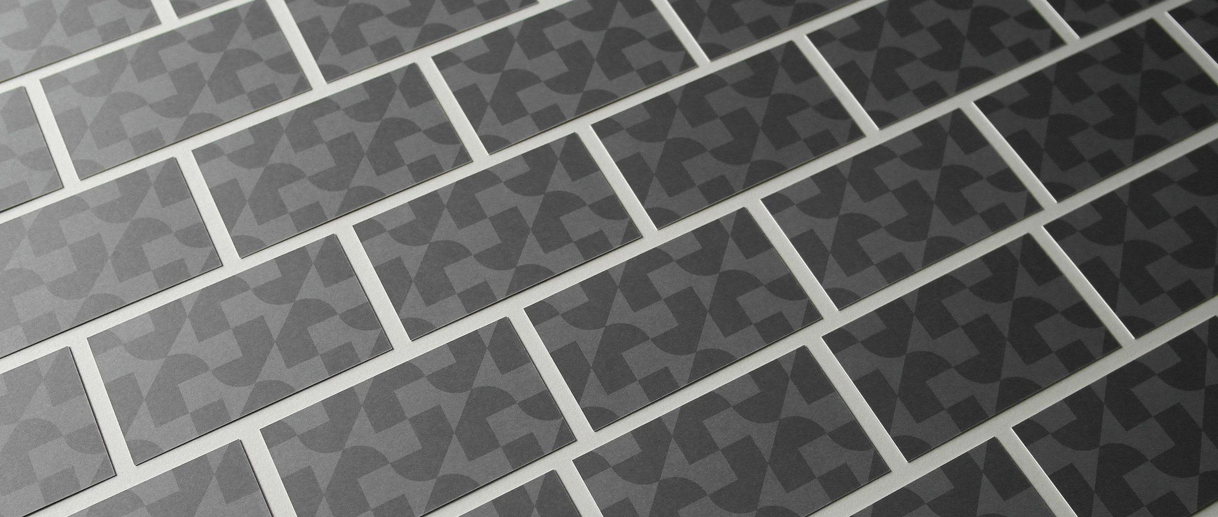 J+R Group business cards in a grid