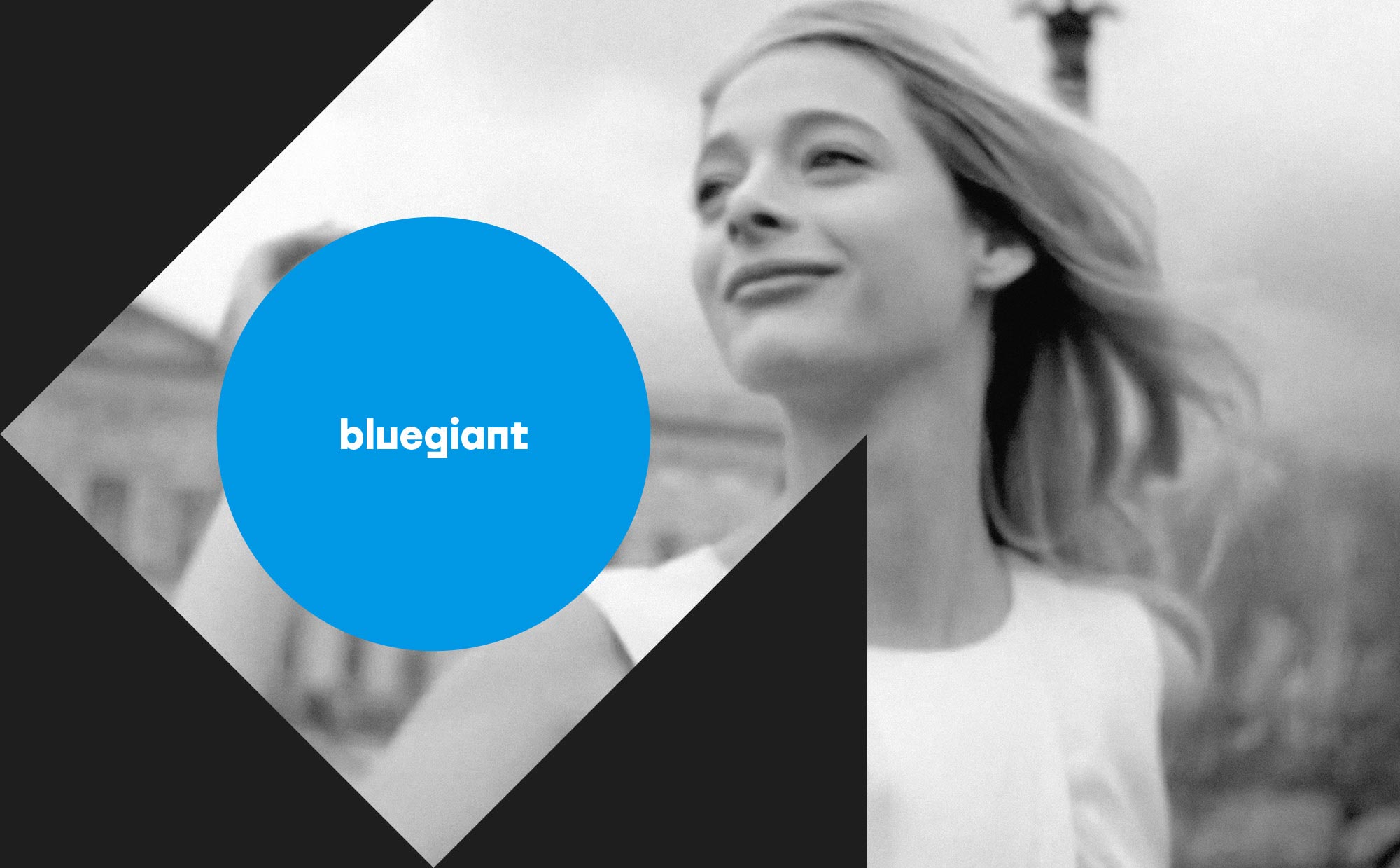 bluegiant logo motif overlaps black and white women image
