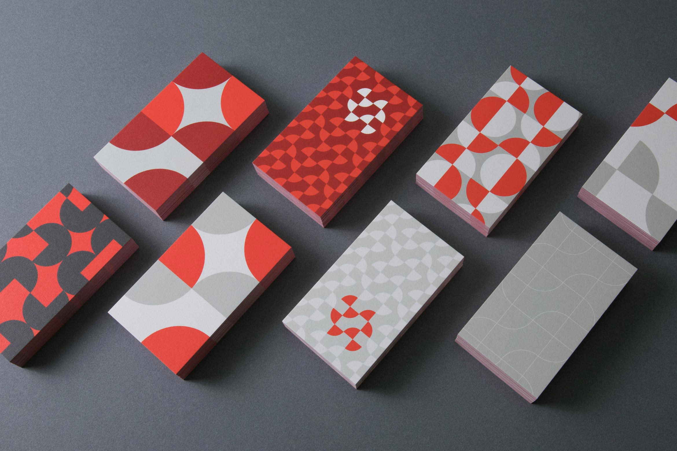set of 8 business card designs using quarter and half circles