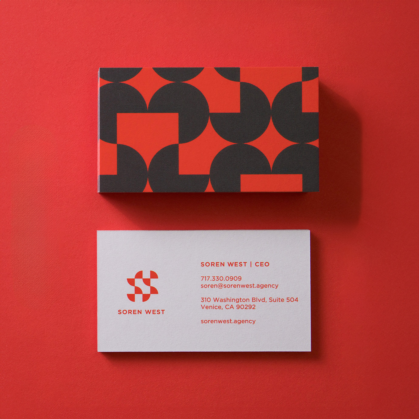 soren west business card front and back on red backdrop