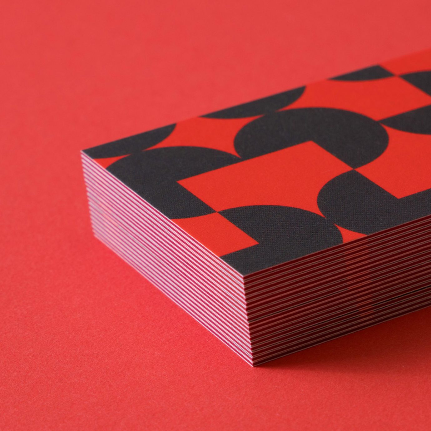 close up of soren west business cards on red backdrop