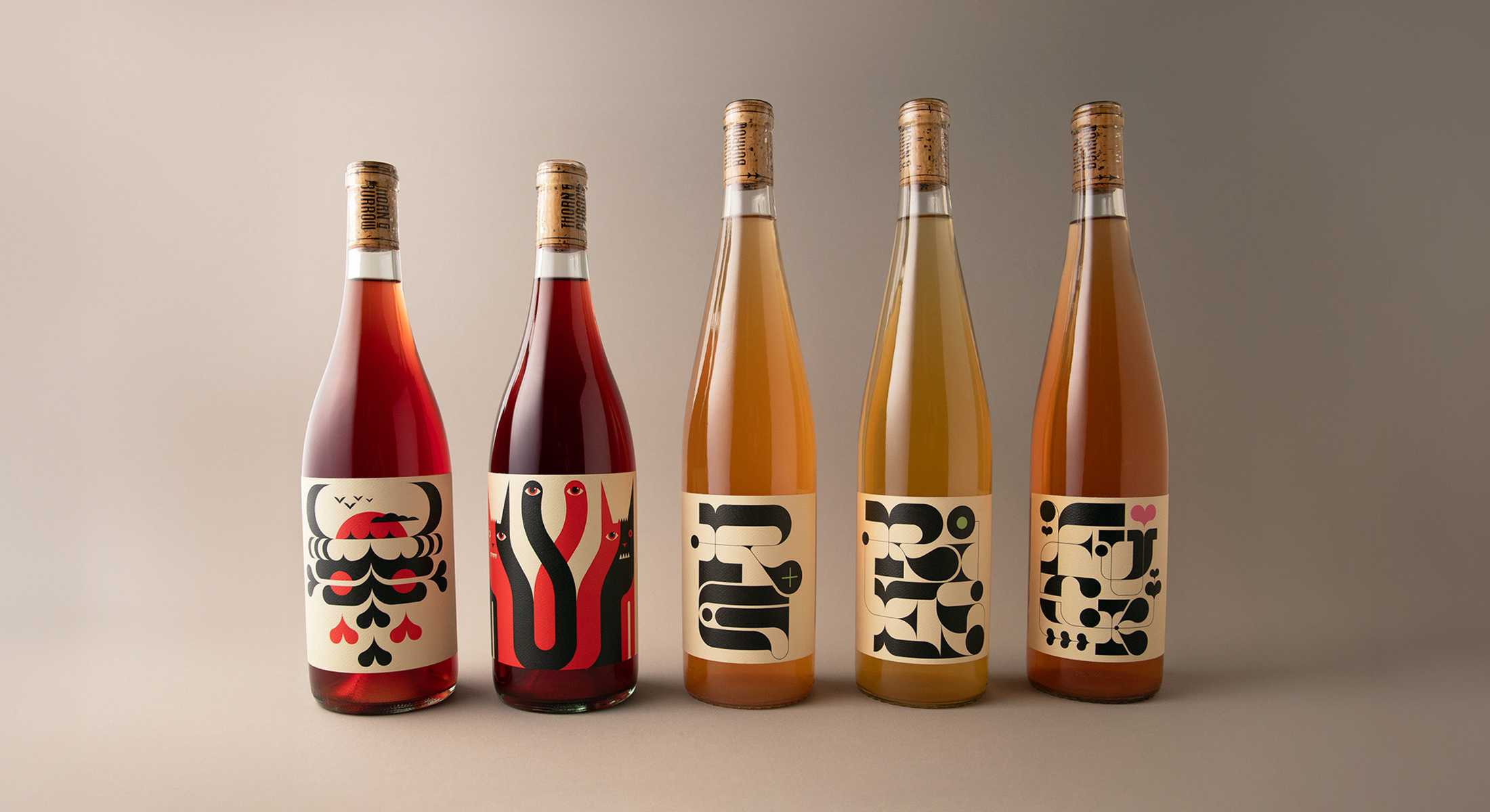 5 bottles of wine with funky label design